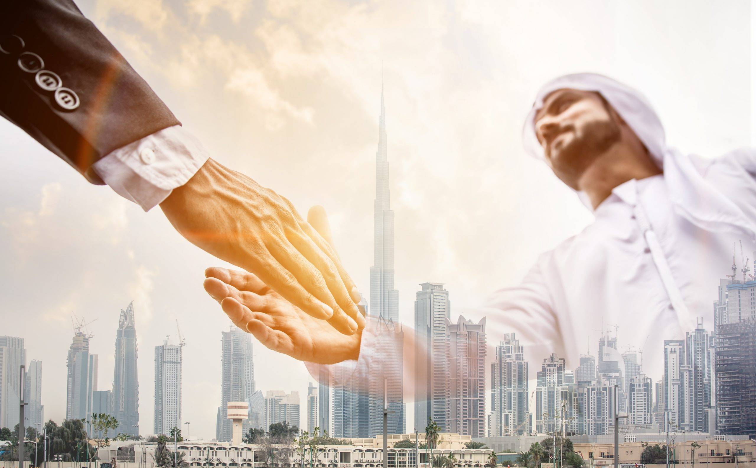 Double,Exposure,Of,Two,Business,Men,Over,Dubai,Skyline,Building